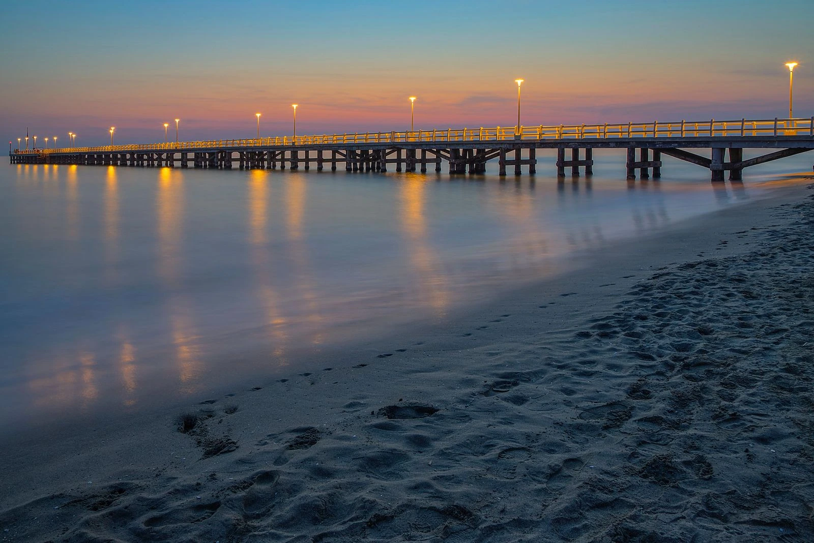 Versilia · A coastal pier at dusk — destination context.