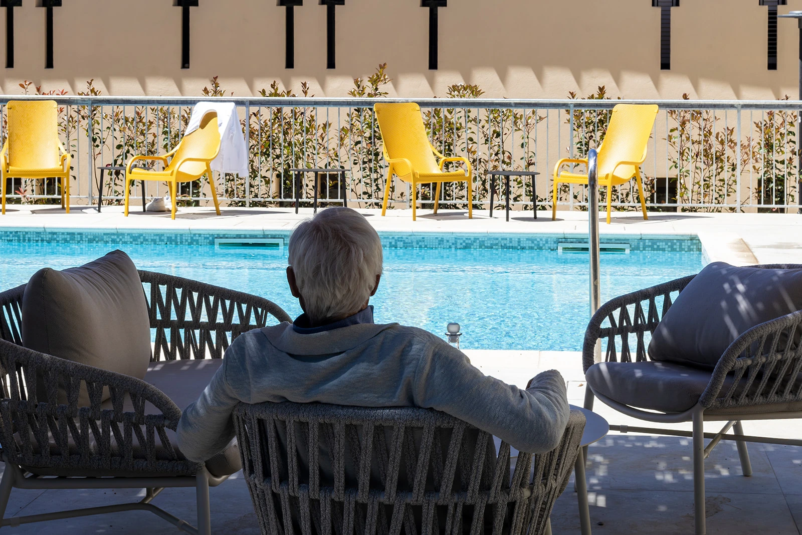 Siena residences · Poolside seating at the Siena residence